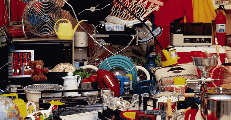 A photograph of a room with a huge amount of items that need decluttering