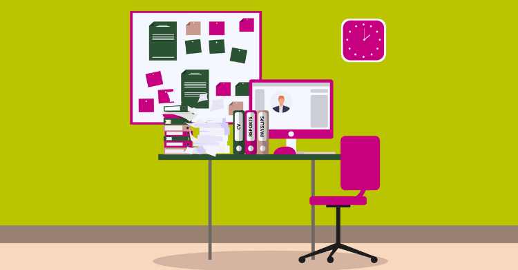 image shows a desk with a computer, notice board and paperwork